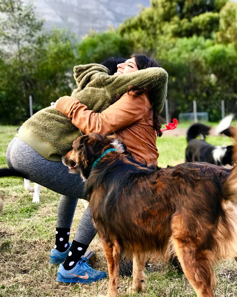 woman hugging woman