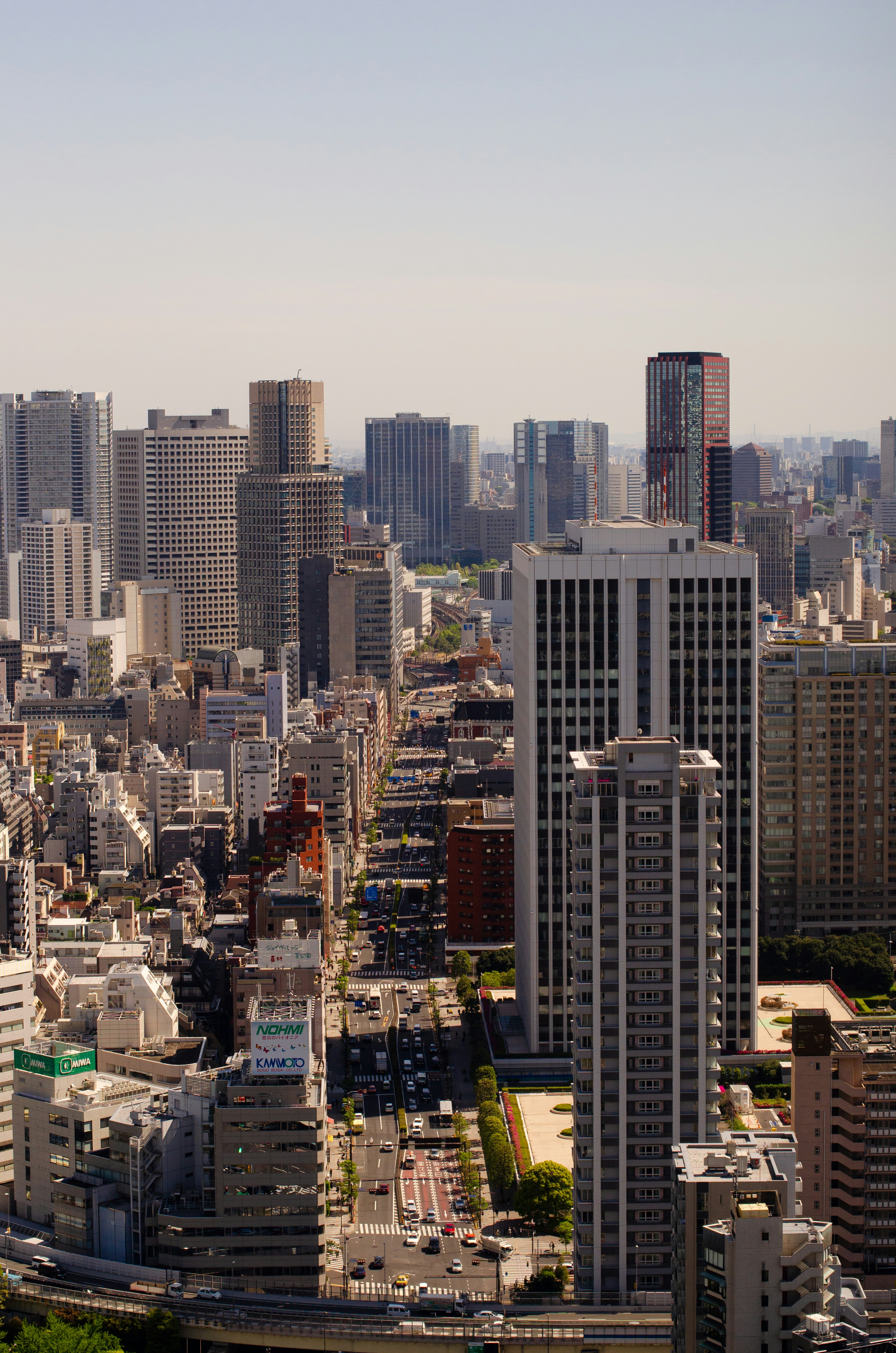 white and black high buildings at daytime