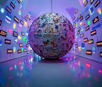 large grey, blue, and brown paper ball ball on display