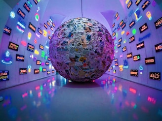 large grey, blue, and brown paper ball ball on display