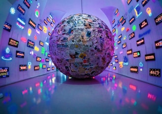 large grey, blue, and brown paper ball ball on display