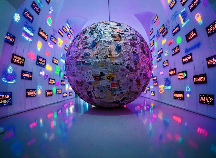 large grey, blue, and brown paper ball ball on display