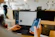 person using phone and laptop