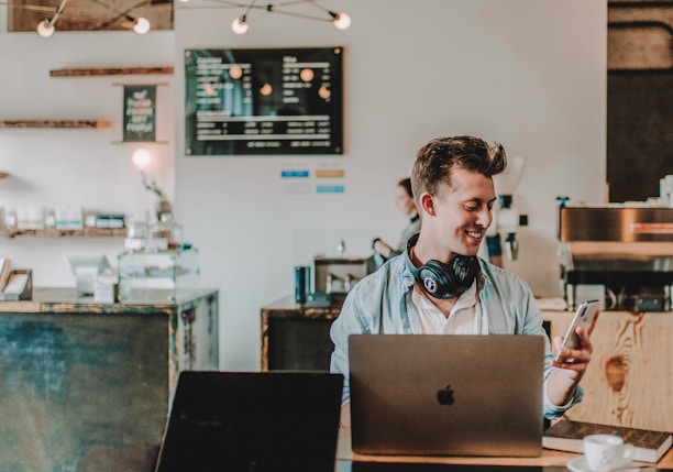 man using smartphone smiling