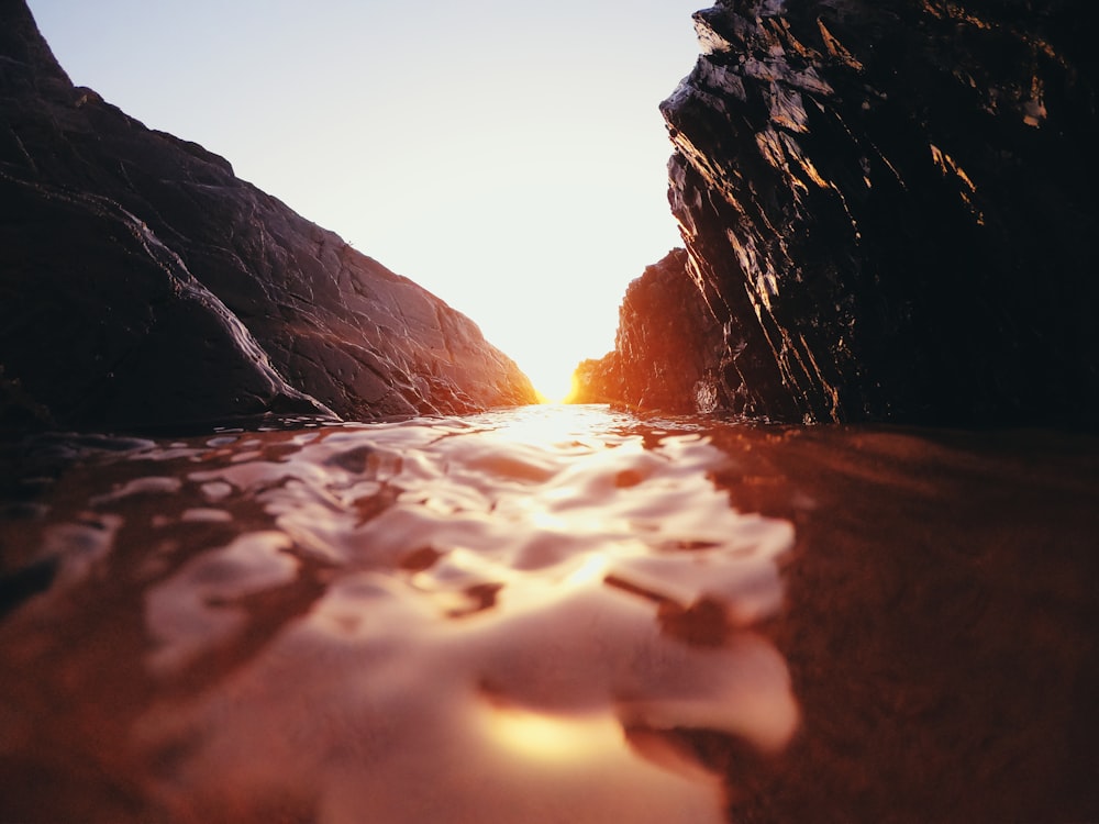 body of water with rocks