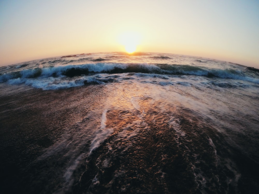 body of water at golden hour