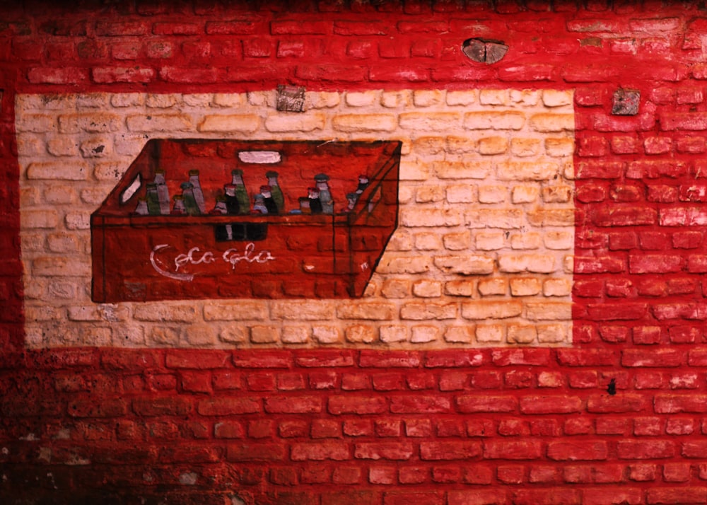 red soda bottle wall art