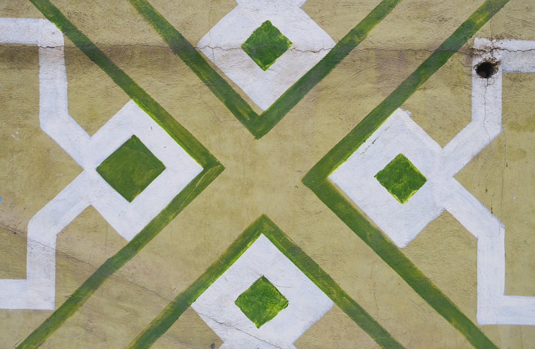 brown, white, and green textile close-up photography