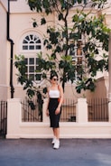 woman standing in front of fence