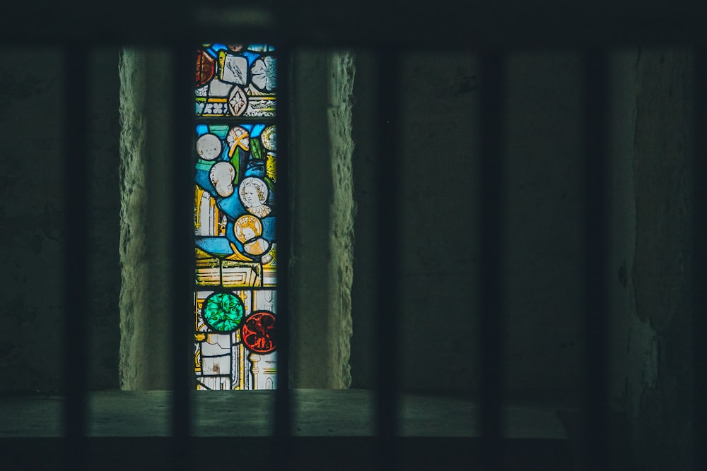 a stained glass window in a jail cell