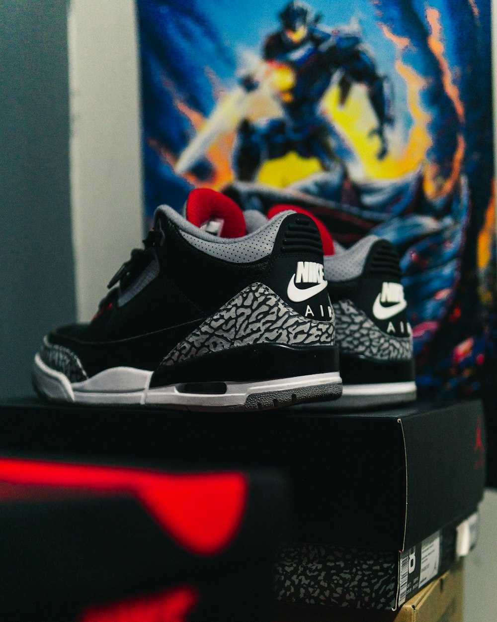 pair of black-red-white Air Jordan 3's with box