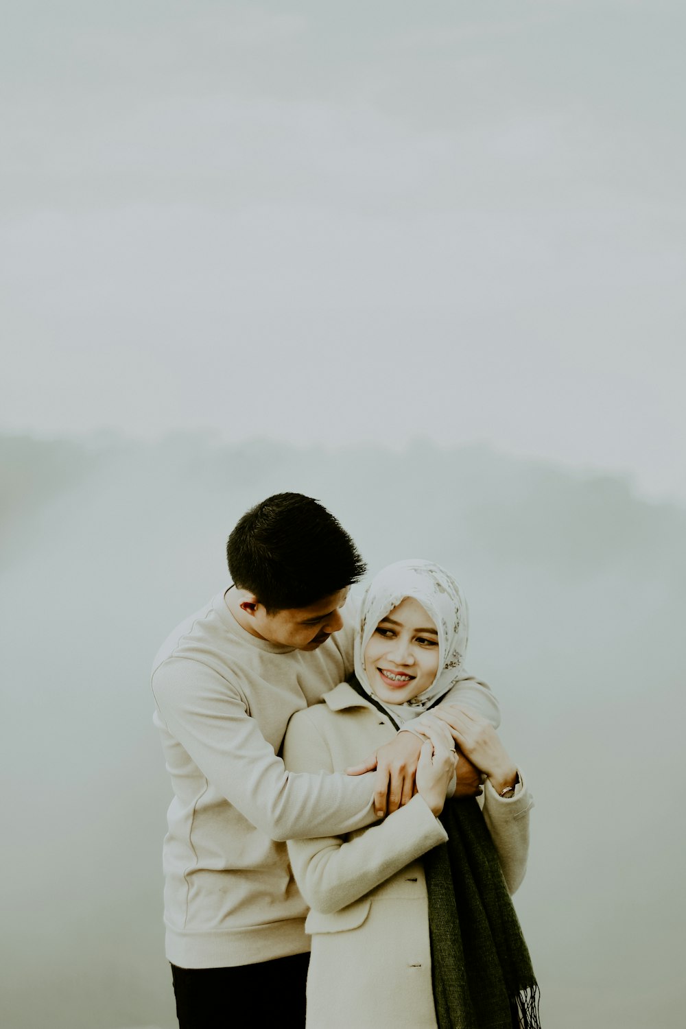 couple hugging during daytime