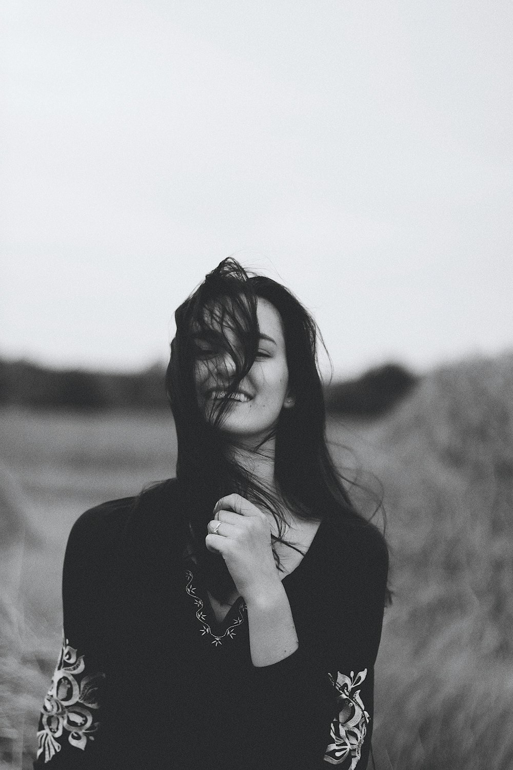 grayscale photography of smiling woman