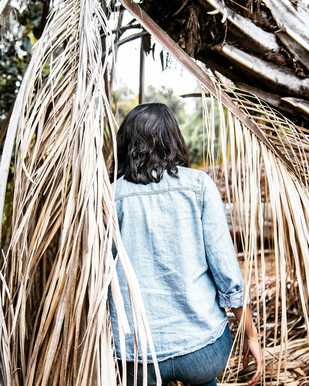 woman in blue chambray long-sleeved shirt