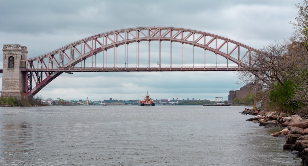 boat about to pass bridge