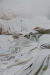white pillows and bed comforter
