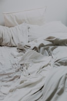 white pillows and bed comforter