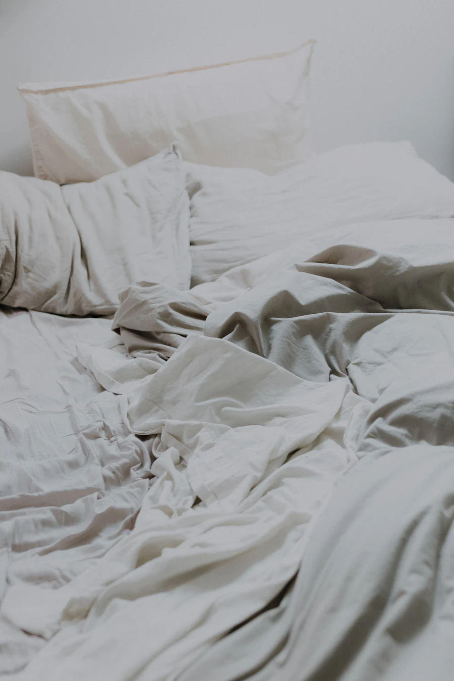 Bed with fresh white sheets and pillows