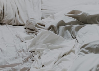 white pillows and bed comforter