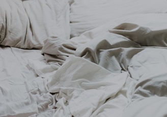 white pillows and bed comforter