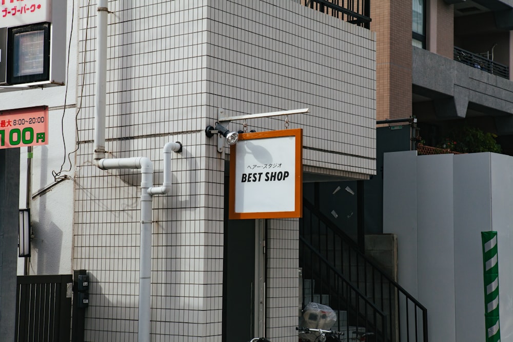 white Best Shop signage