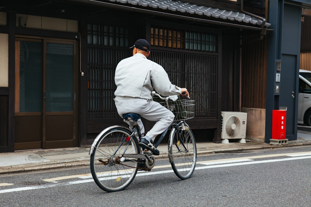man riding on commuter bike