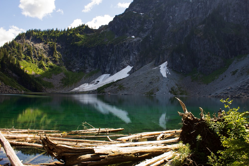 body of water near hills during daytime