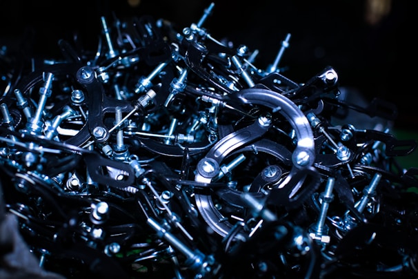 Close-up of shiny metal scraps piled together in a warehouse.