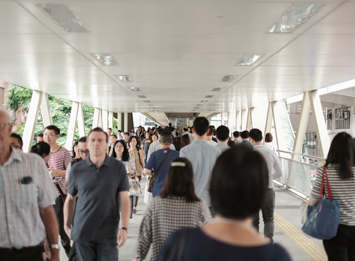 group of people walking inside building