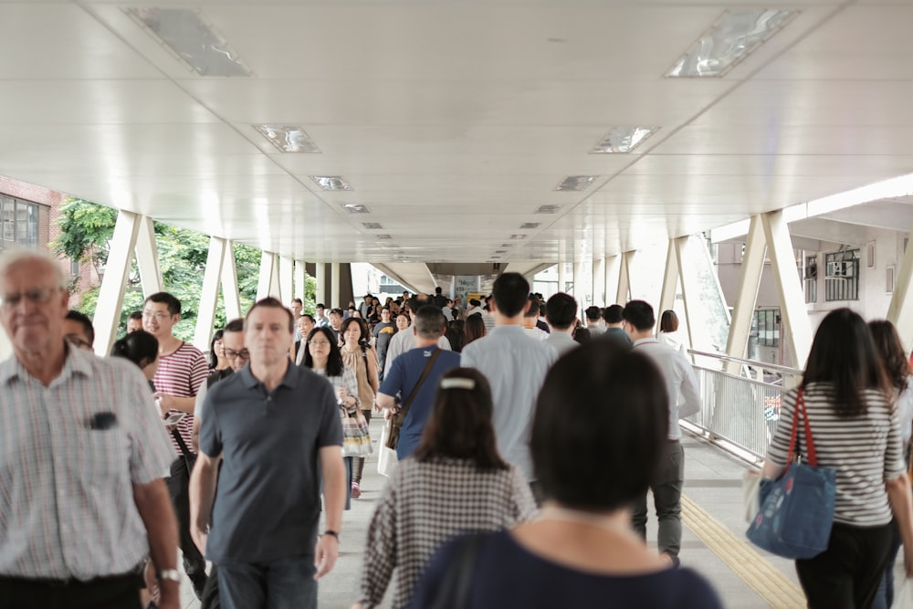 group of people walking inside building