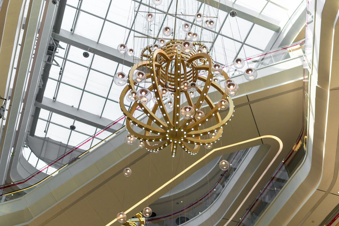 selective focus photography of gold chandelier