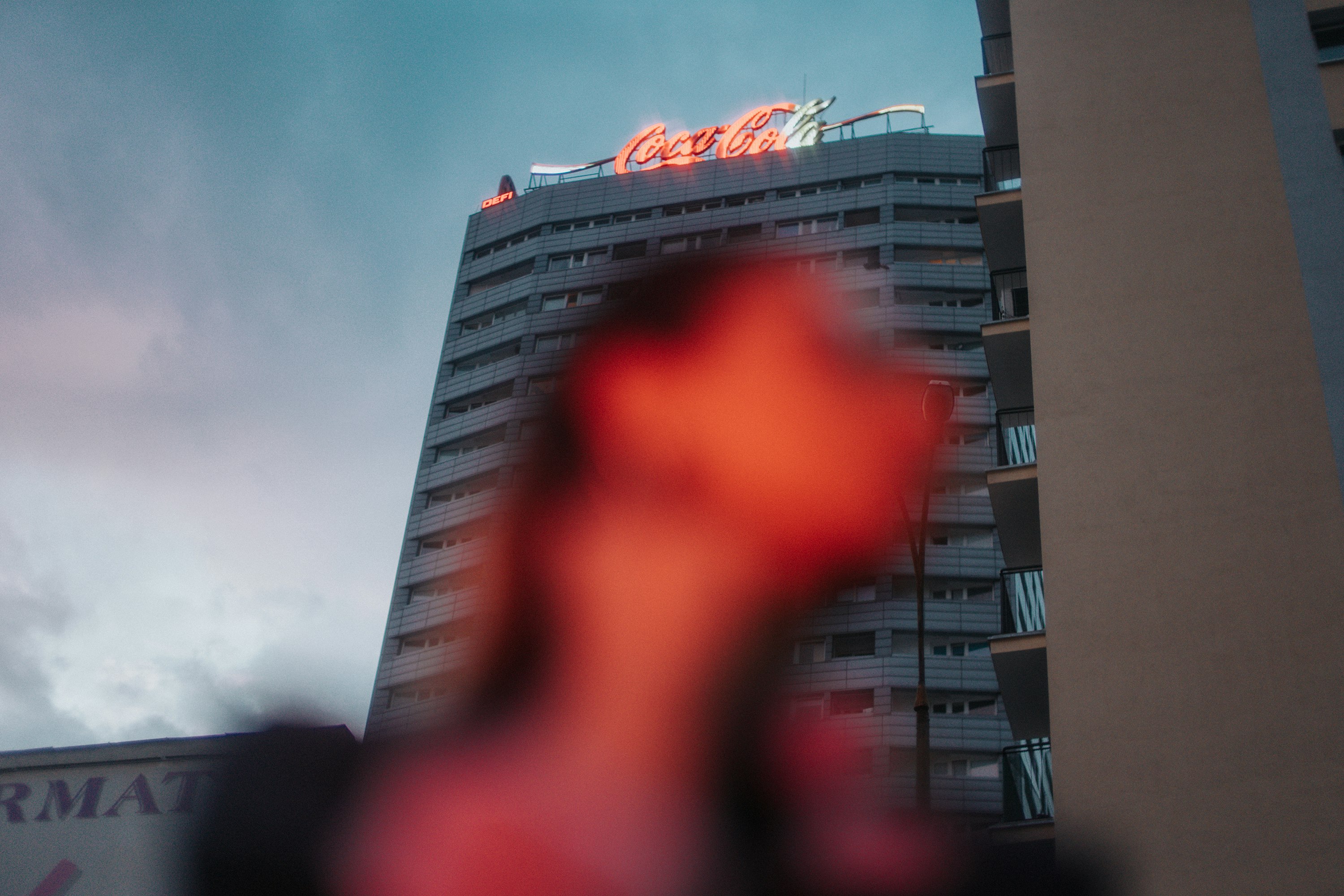 close-up photography of woman near building