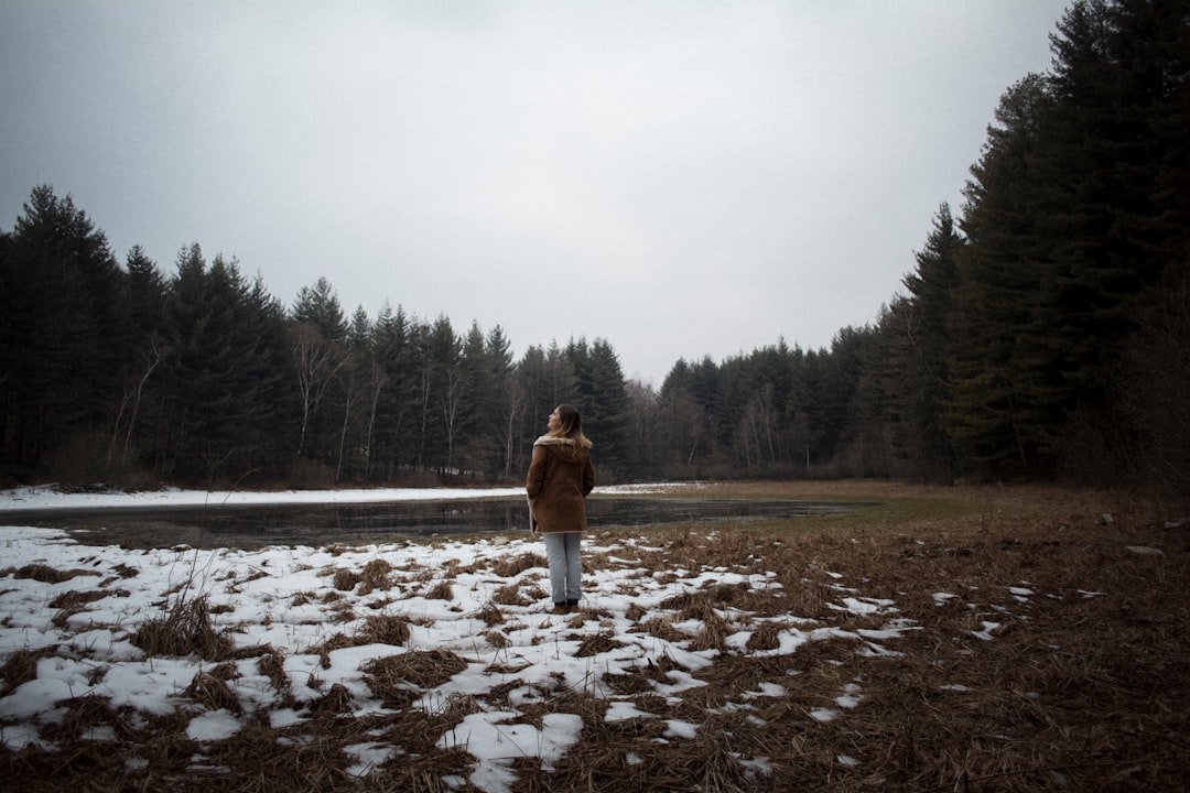 person standing surround by trees