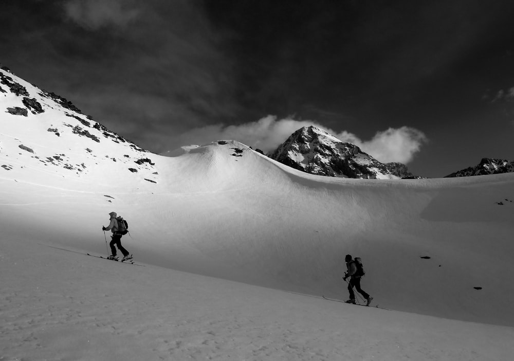 grayscale photography unknown persons walking outdoors