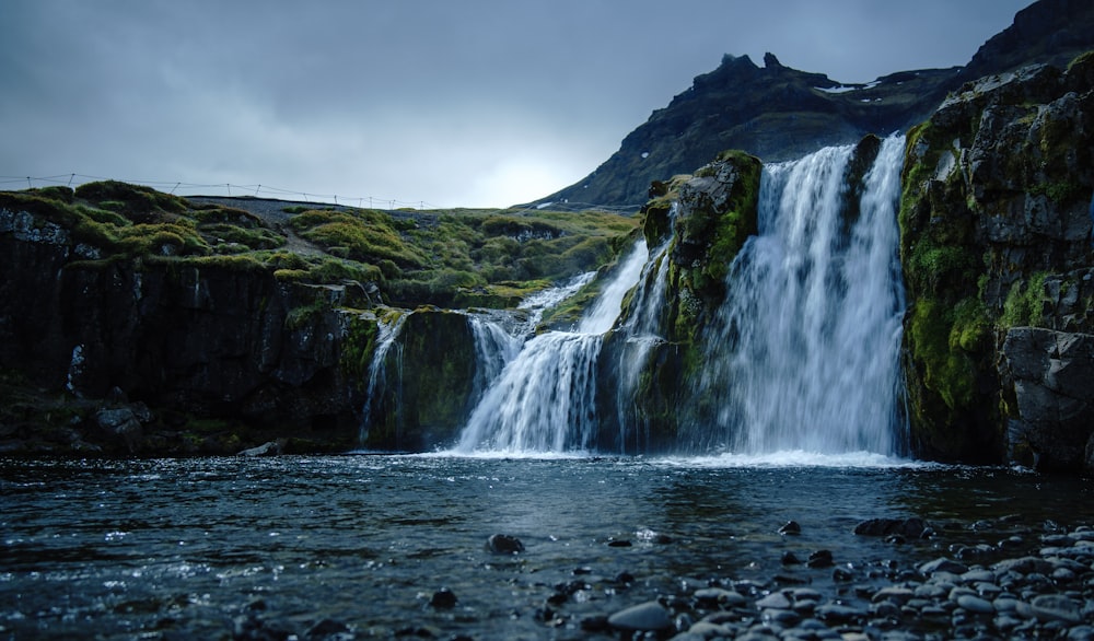 shallow focus photo of waterfalls during daytime