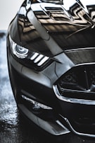 A close-up of a car's polished surface reflecting light beautifully.