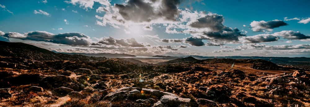 white clouds under desert during daytime