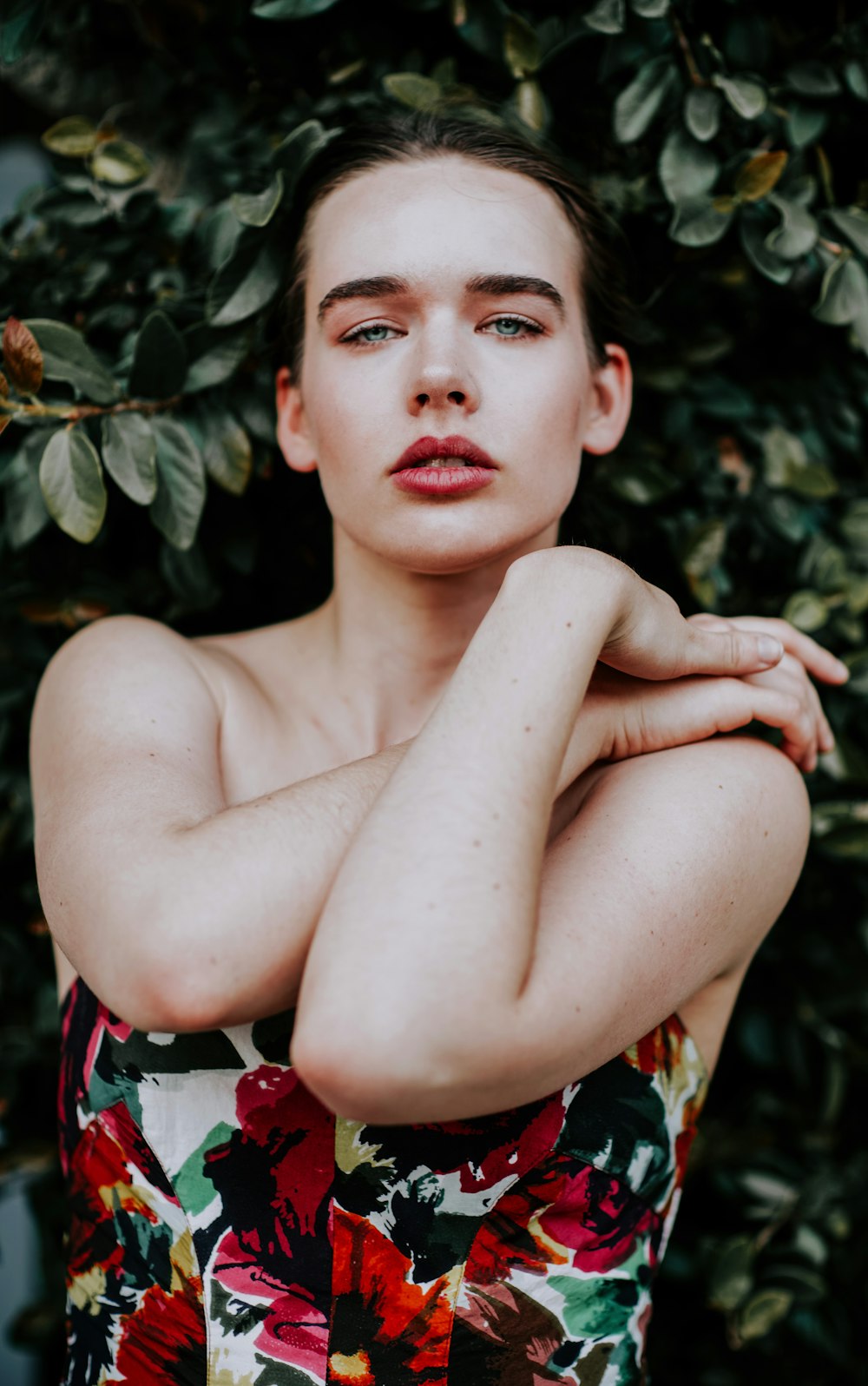 woman wearing white and multicolored floral tube top