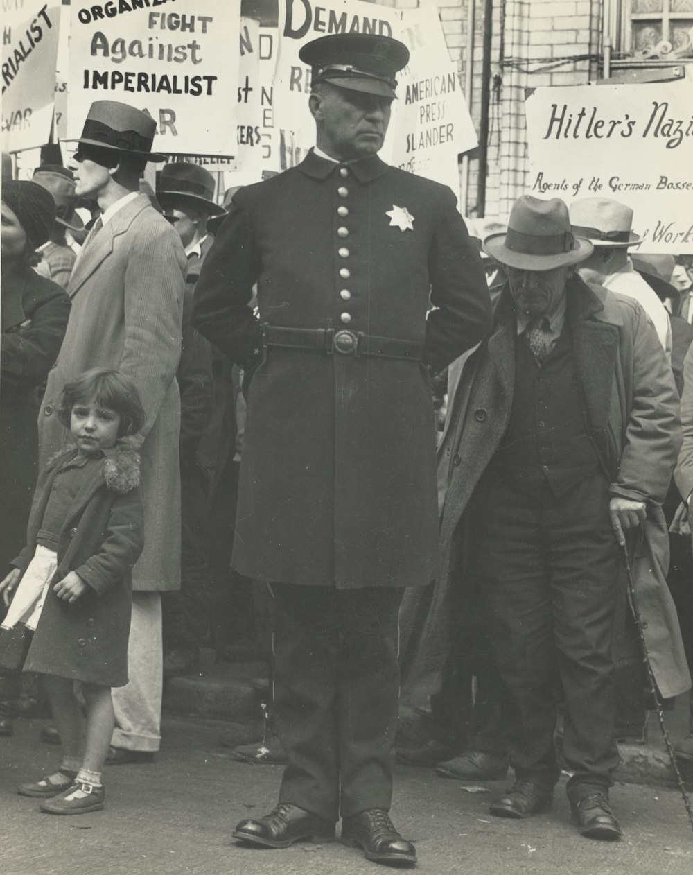 greyscale photo of man wearing coat