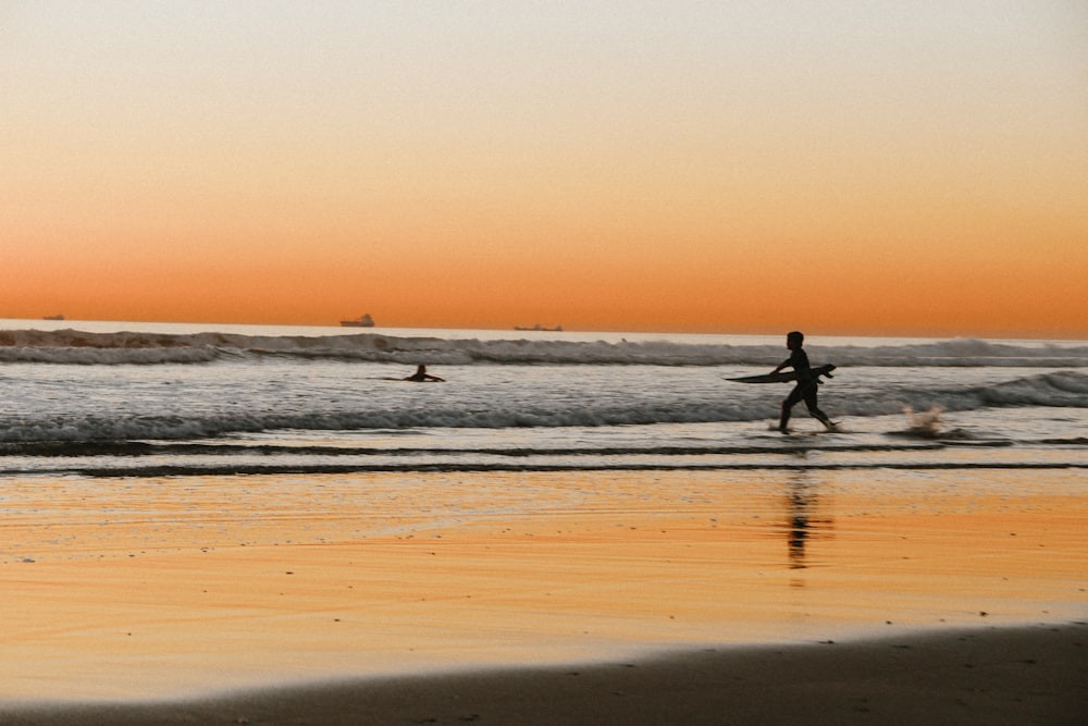 boy playing by the sea