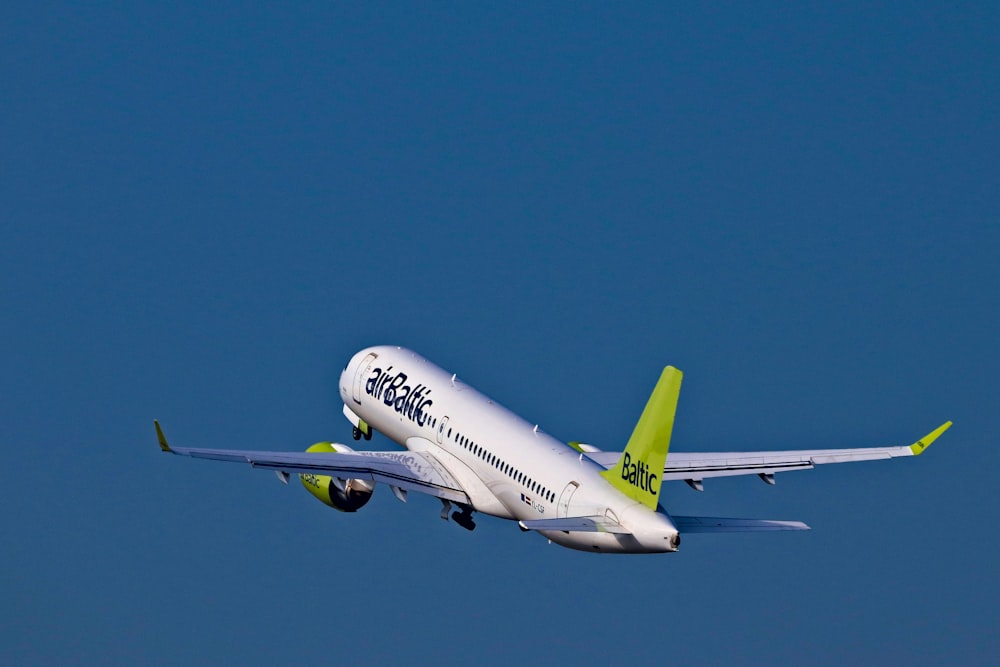 white and green Air Baltic passenger plane