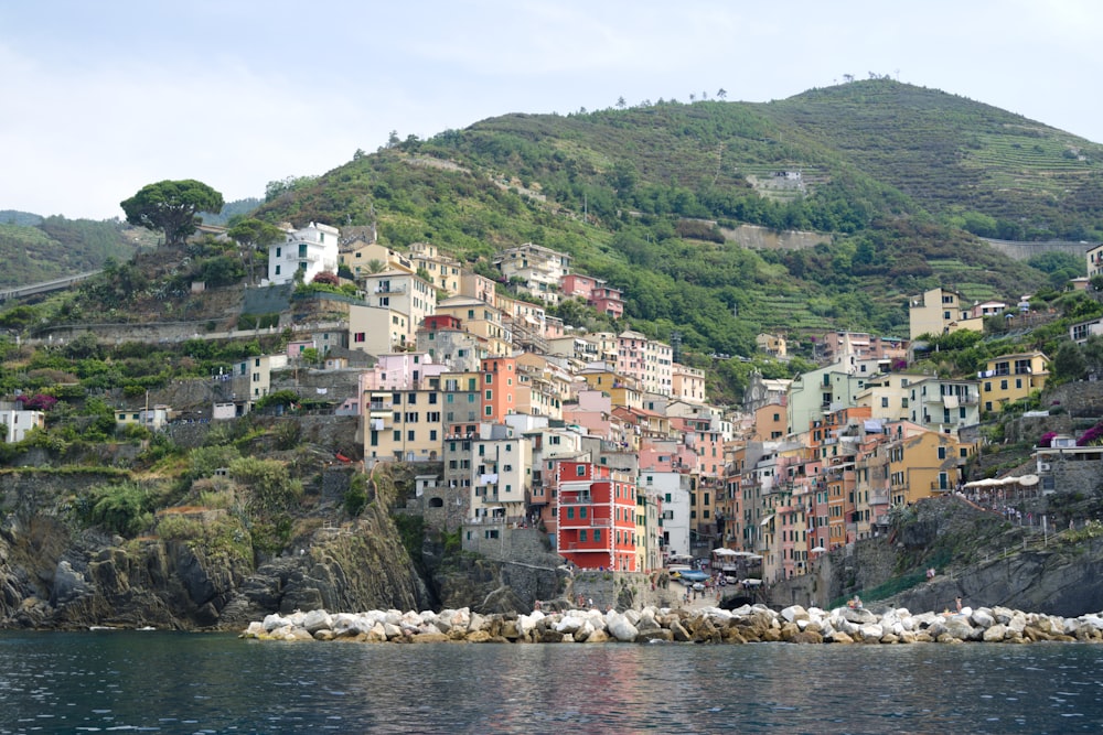 house on cliff near calm water