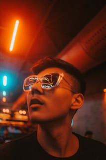 man in sunglasses looking up