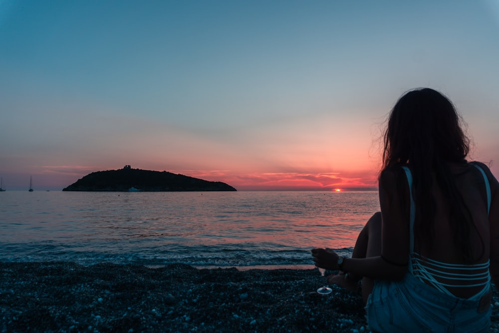 silhouette of woman on seashore