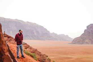 man standing on hill