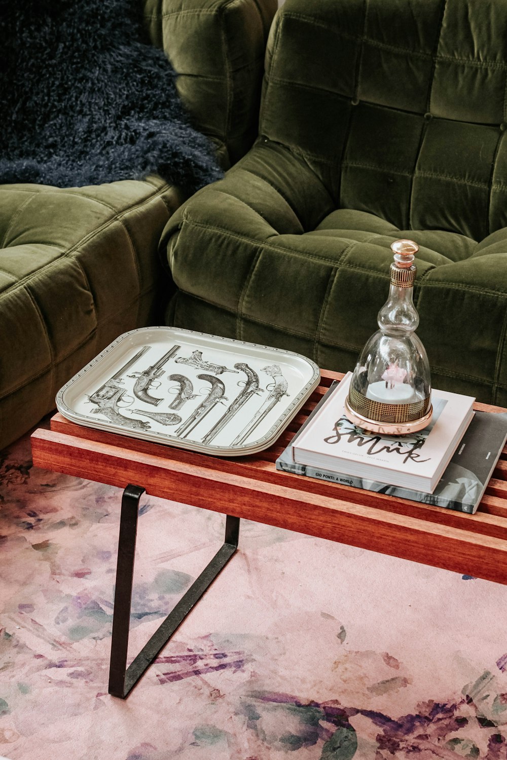 gray plastic tray on brown wooden center table