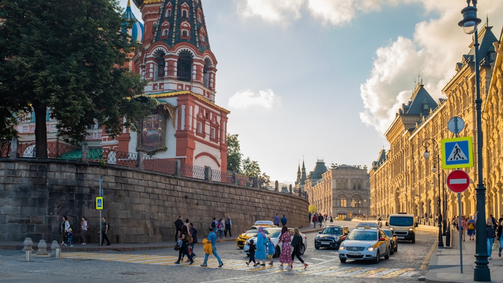 people crossing street during daytime