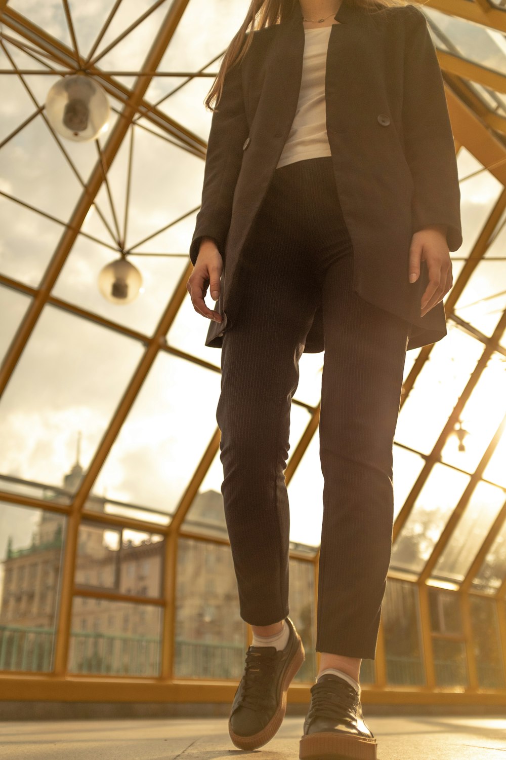 woman walking inside greenhouse