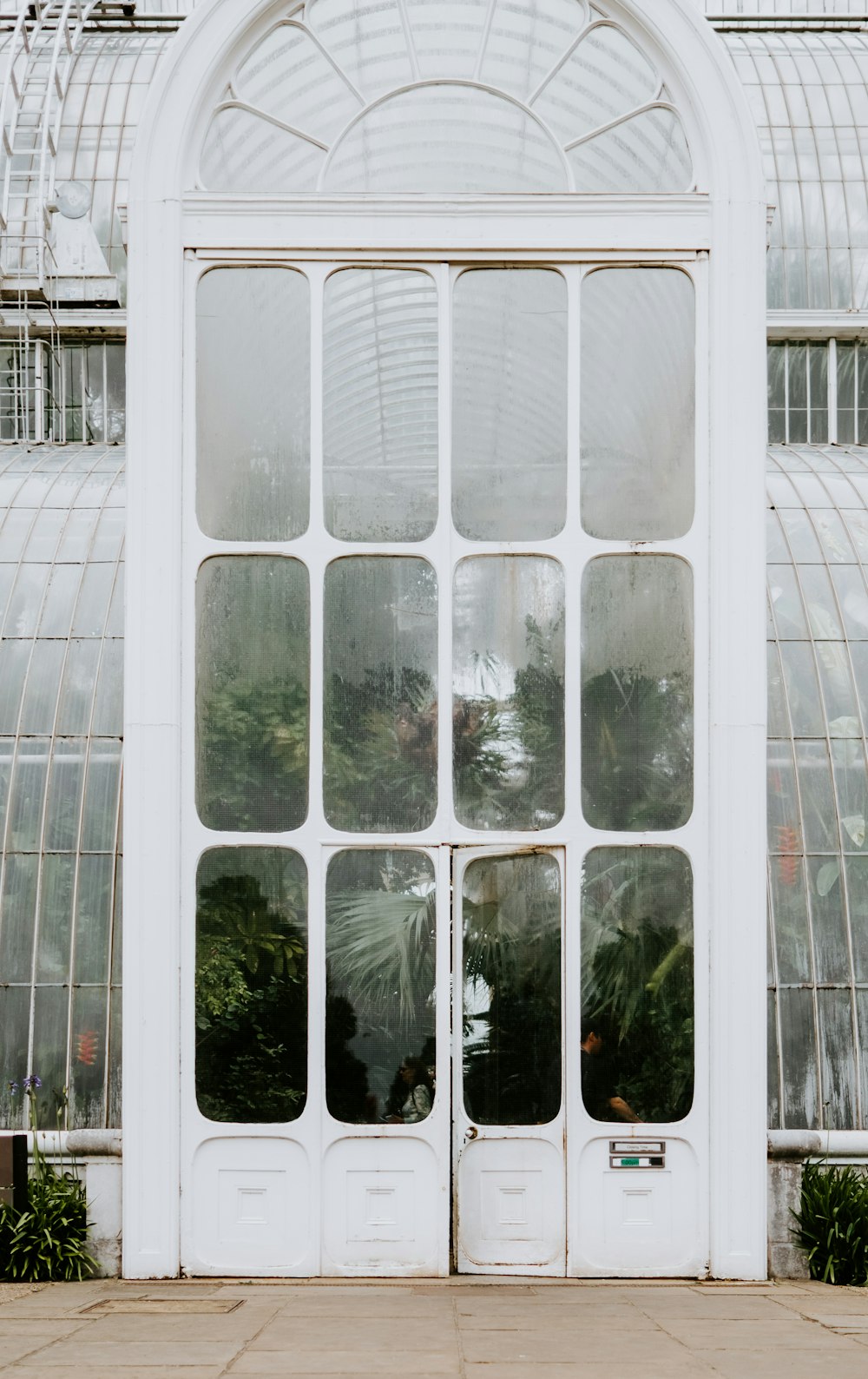 closed white wooden framed glass door