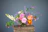 A vibrant bouquet of alstroemeria and rosas arranged elegantly in a rustic vase.